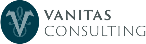 The logo for Vanitas Consulting, featuring a dark teal circular emblem with a stylized white 'V' and symbol on the left, next to the words 'VANITAS CONSULTING' in dark grey  text on a white background.