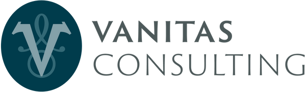 The logo for Vanitas Consulting, featuring a dark teal circular emblem with a stylized white 'V' and symbol on the left, next to the words 'VANITAS CONSULTING' in dark grey  text on a white background.
